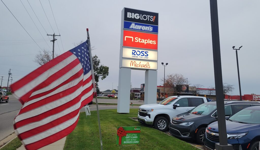 The sign at the entrance to Crossroads Plaza, pictured in early November, advertises the Michaels store that is scheduled to open in July.